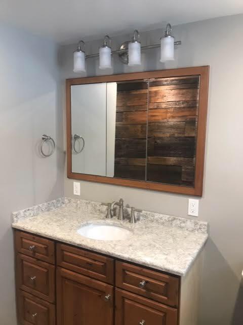 bathroom sink, counter and mirror