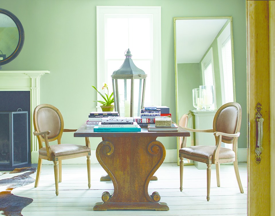 Chairs at a wooden table with a fireplace off to the left Burnt Hills NY