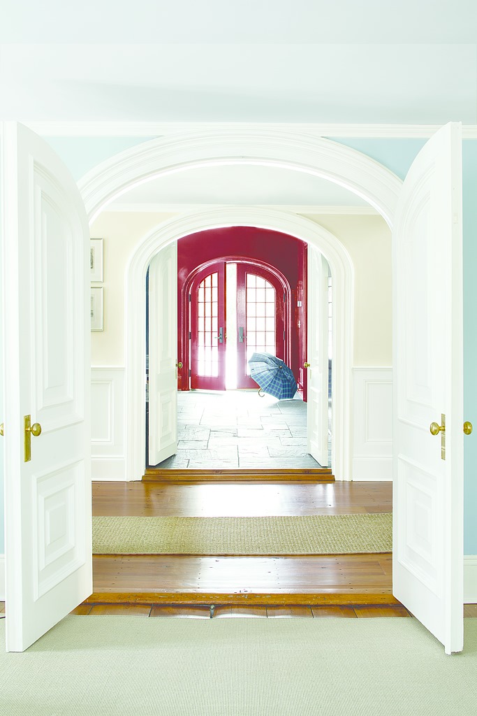 grant home entrance with large white doors and a red room in the back Glenville