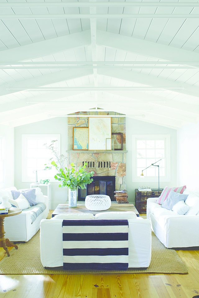 living room with white walls and two couches on either side